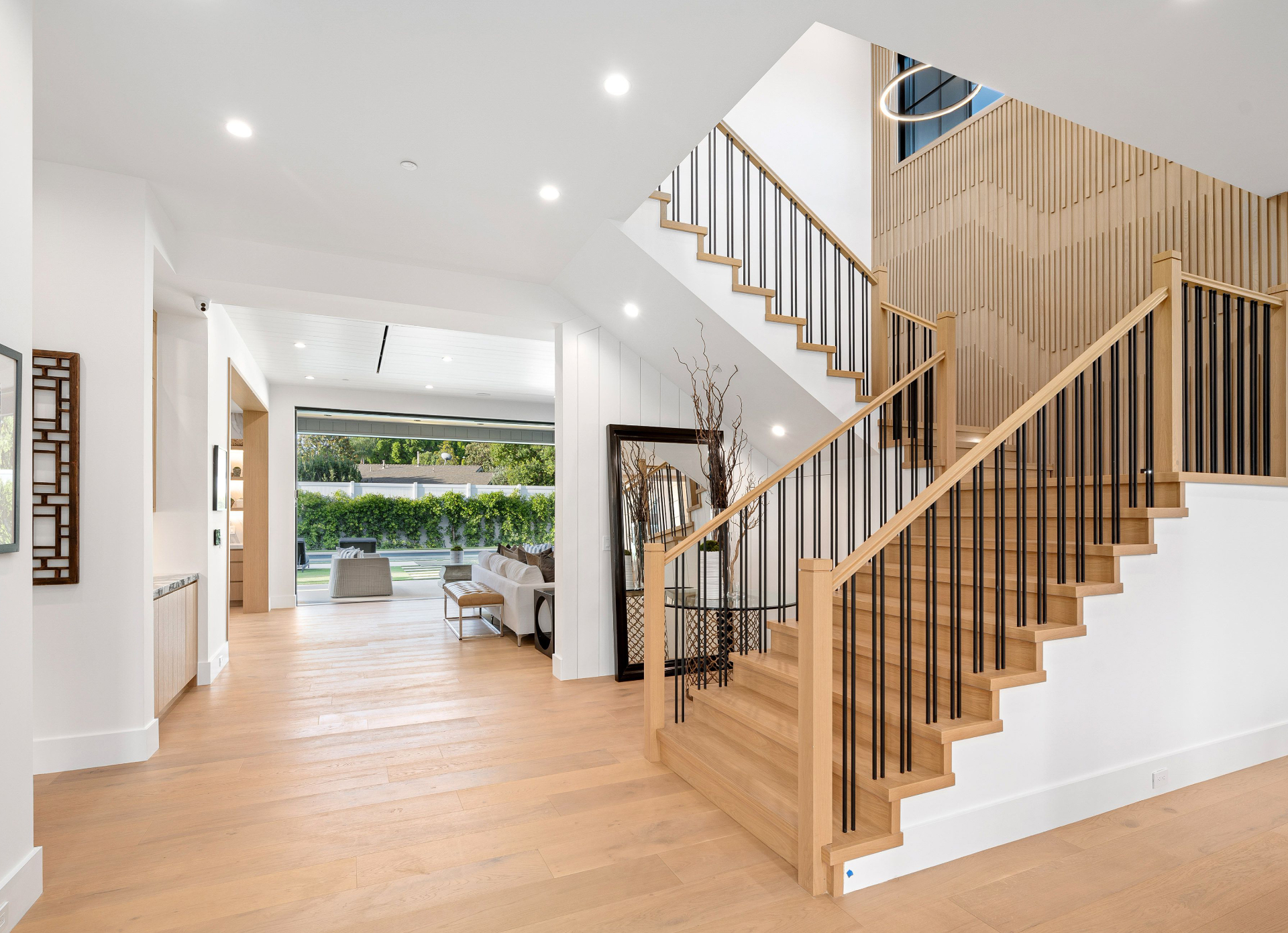 Elegant American home staircase with turned newel posts and warm wood treads